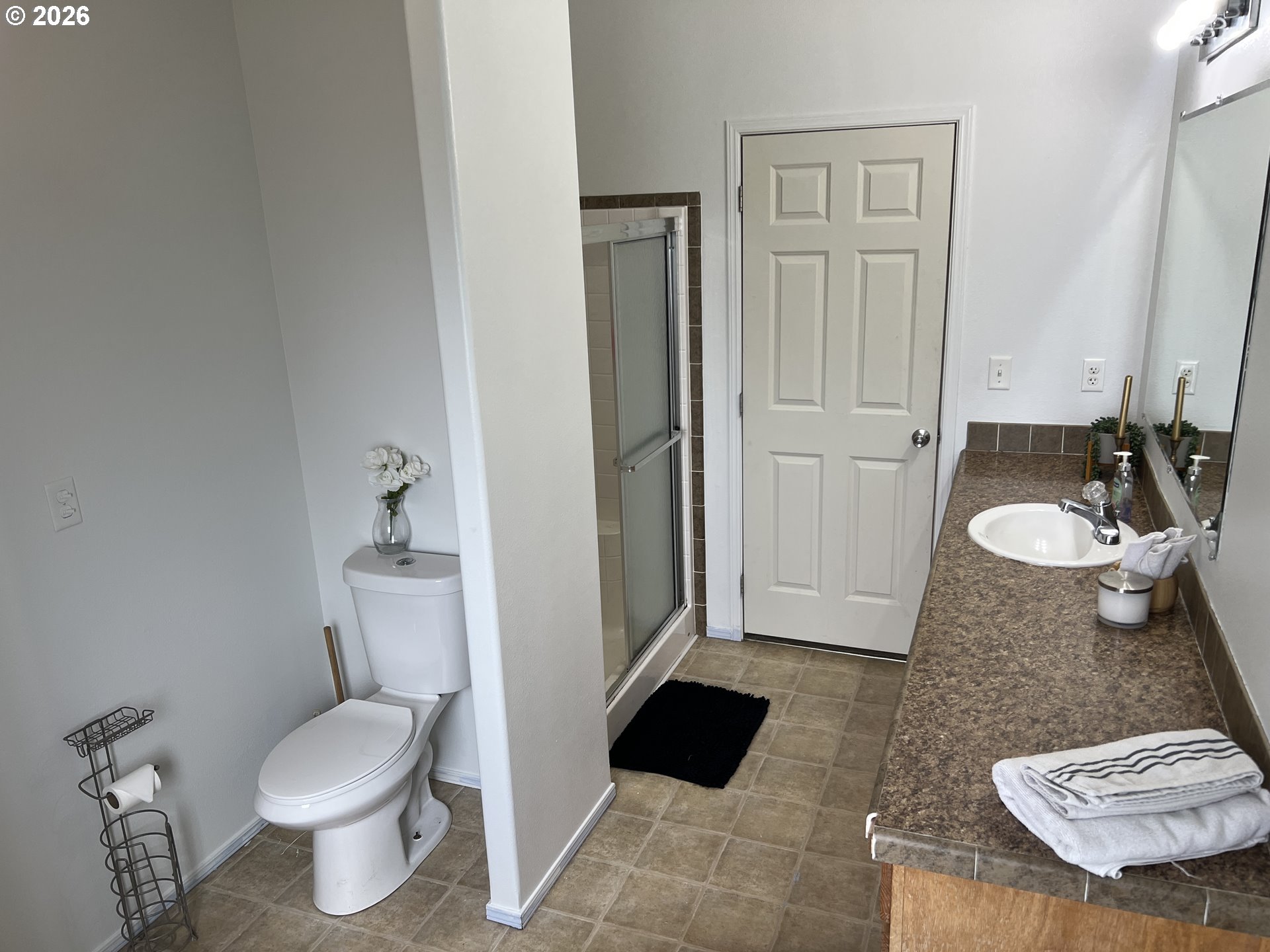 210 Northwest Grinstead Street Siletz, OR 97380 - Photo 19 of 29 a bathroom with a sink toilet and shower