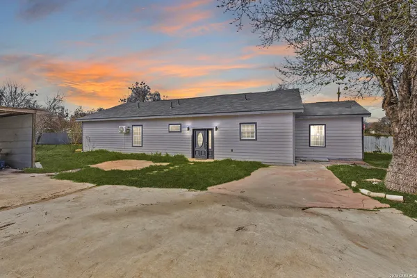 front view of a house with a yard