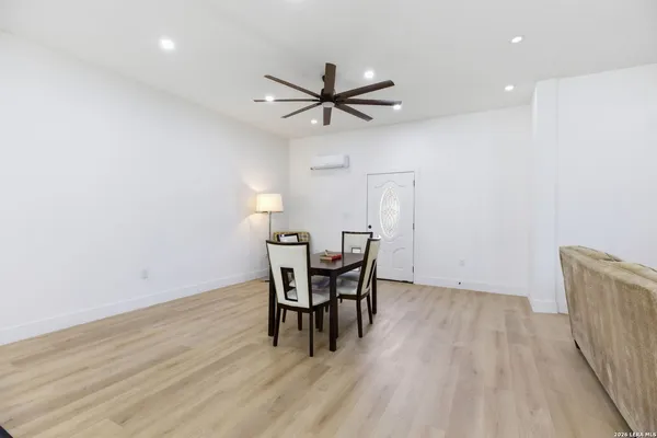 a dining room with furniture and window
