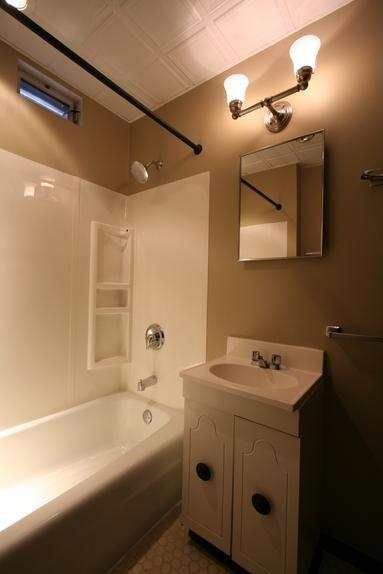 829 Maple Avenue Turtle Creek, PA 15145 - Photo 12 of 20 a bathroom with a sink a mirror and a bathtub