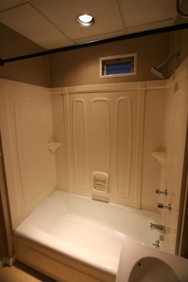 829 Maple Avenue Turtle Creek, PA 15145 - Photo 18 of 20 a bathroom with a bathtub and shower
