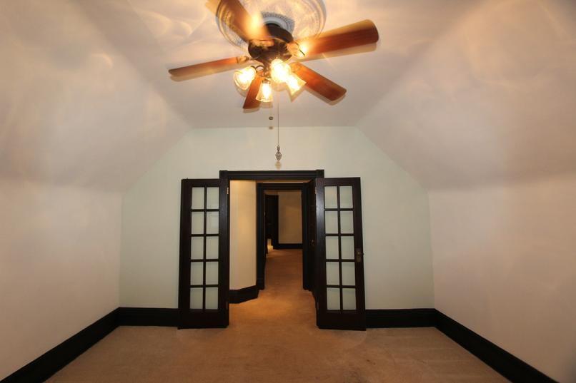 829 Maple Avenue Turtle Creek, PA 15145 - Photo 5 of 20 an empty room with chandelier fan and closet