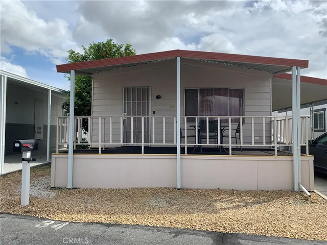 a view of a house with more windows and plants
