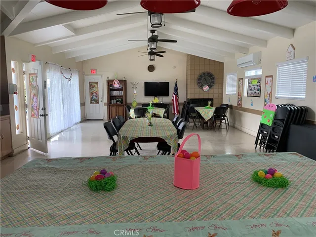 a living room with furniture and flat screen tv