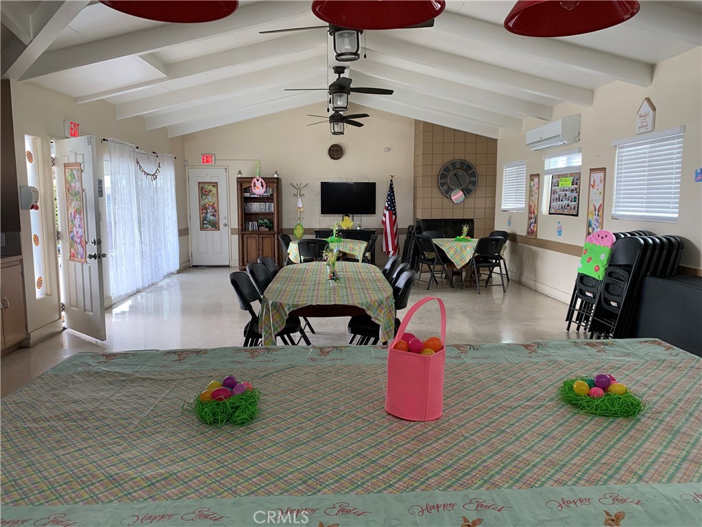 999 South Santa Fe Avenue, Unit 34 San Jacinto, CA 92583 - Photo 4 of 5 a living room with furniture and flat screen tv