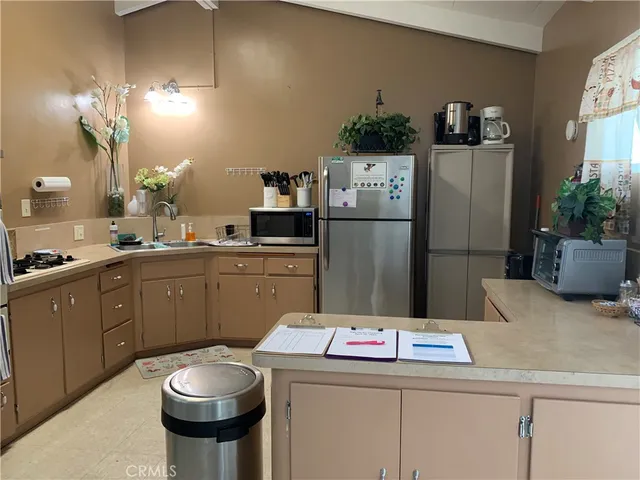 a kitchen with a sink and refrigerator