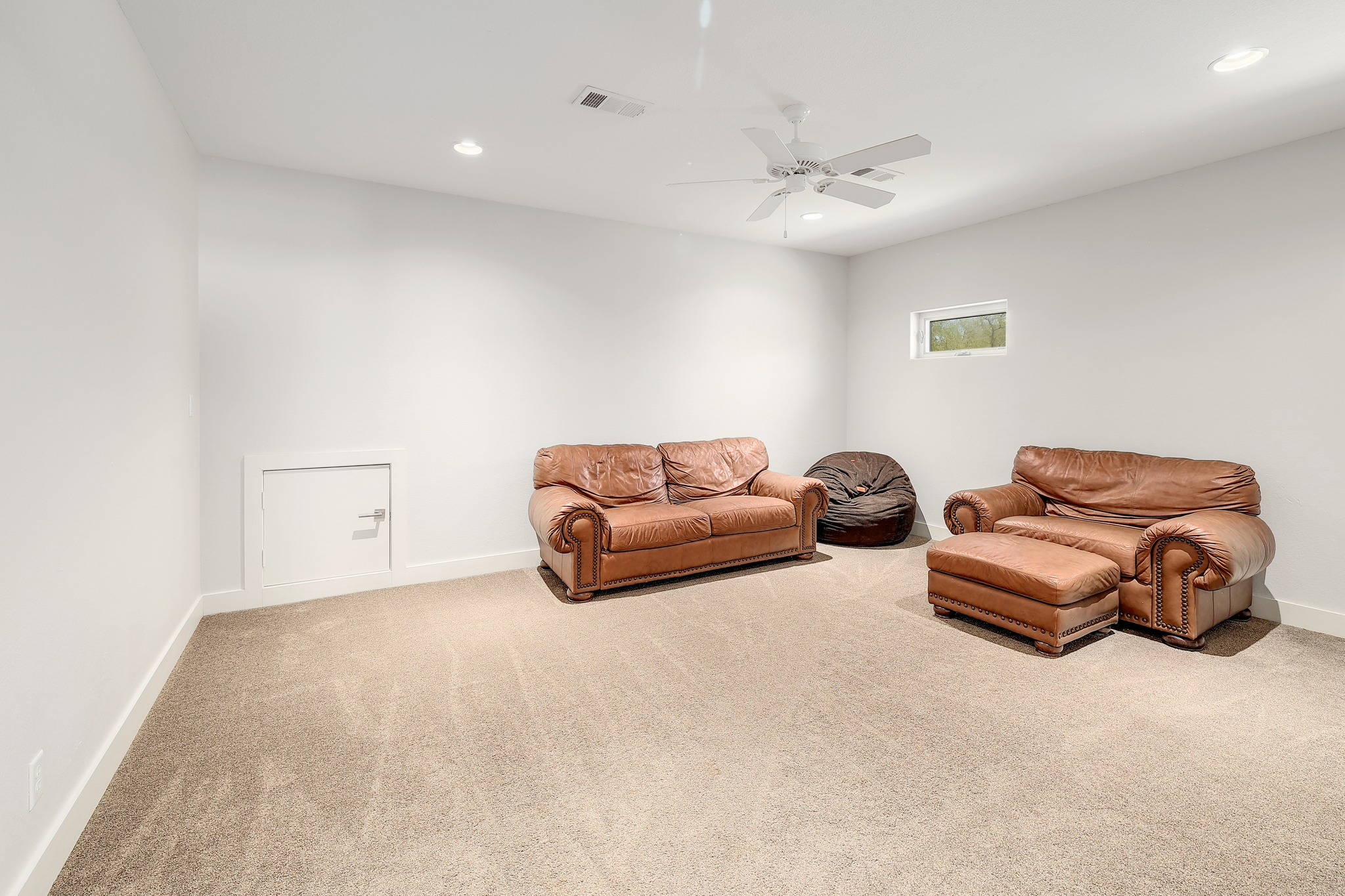 23928 Oscar Road Spicewood, TX 78669 - Photo 22 of 40 a room with a couch and a chandelier