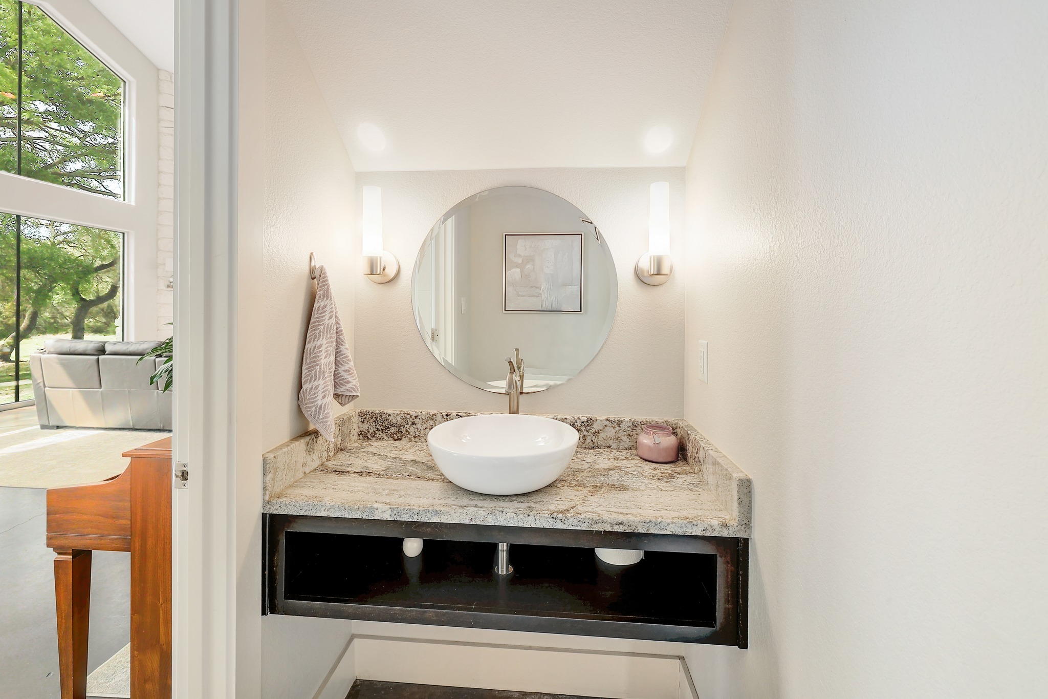23928 Oscar Road Spicewood, TX 78669 - Photo 25 of 39 a bathroom with a sink and a mirror