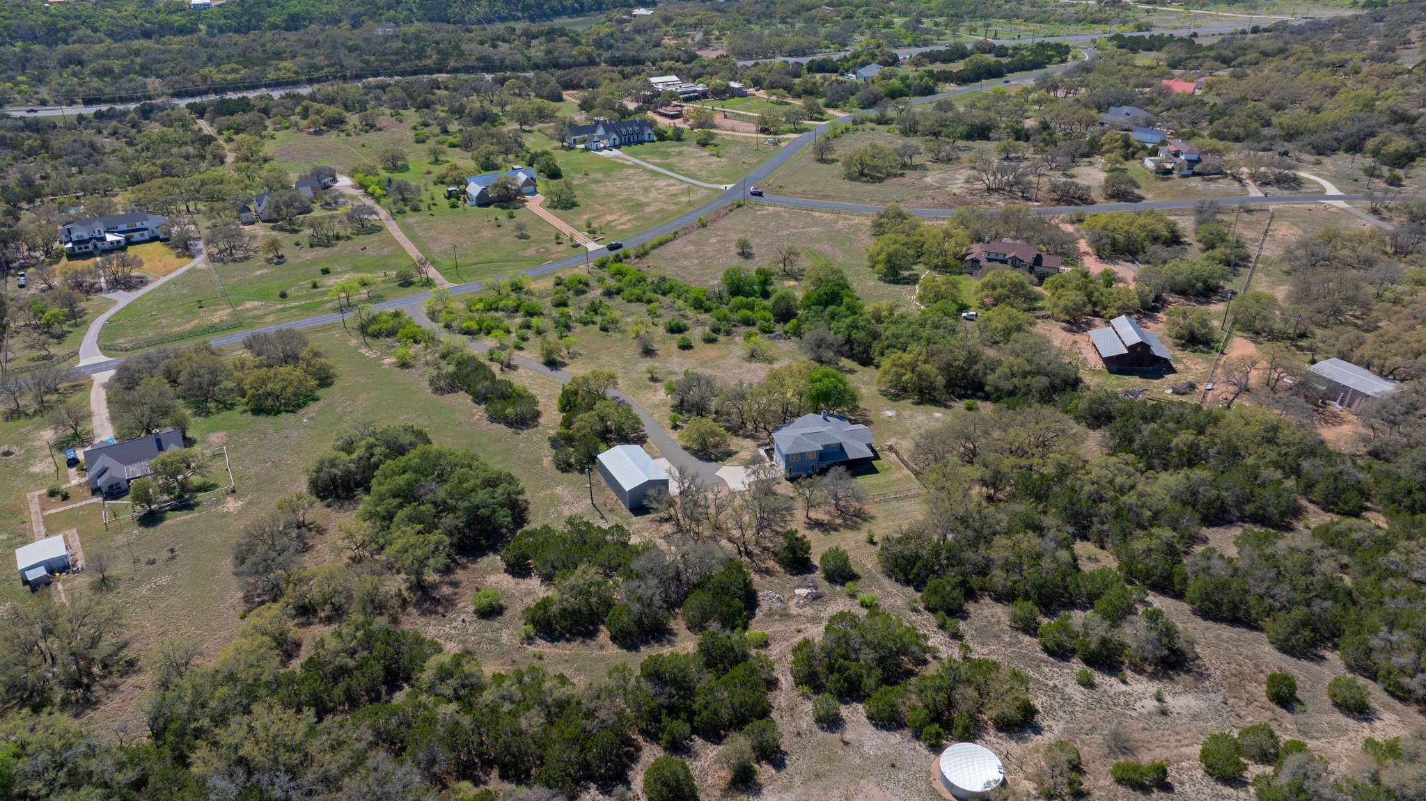 23928 Oscar Road Spicewood, TX 78669 - Photo 35 of 39 an aerial view of house with yard and outdoor seating