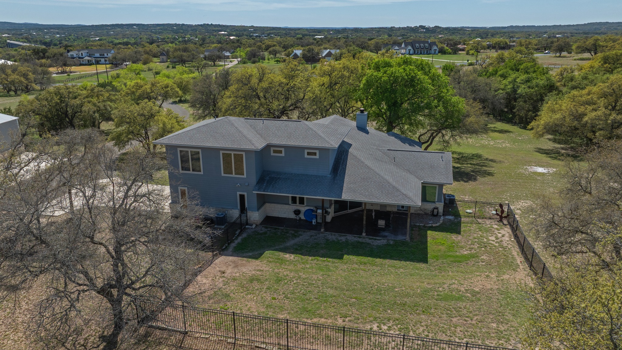 23928 Oscar Road Spicewood, TX 78669 - Photo 37 of 39 an aerial view of a house with a yard