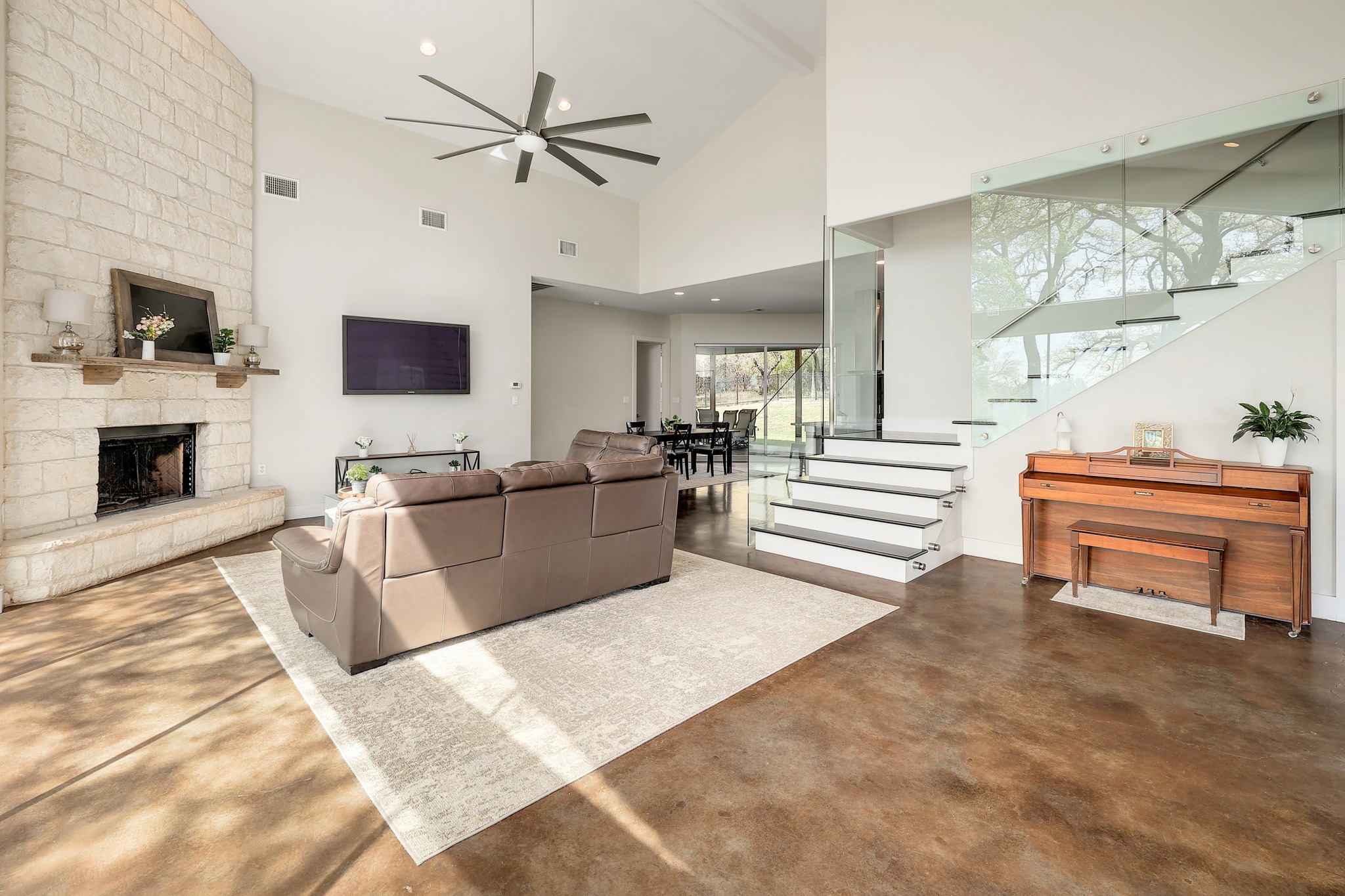 23928 Oscar Road Spicewood, TX 78669 - Photo 7 of 40 a living room with furniture and a fireplace