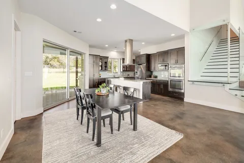 a room with furniture a baby crib and a book shelf