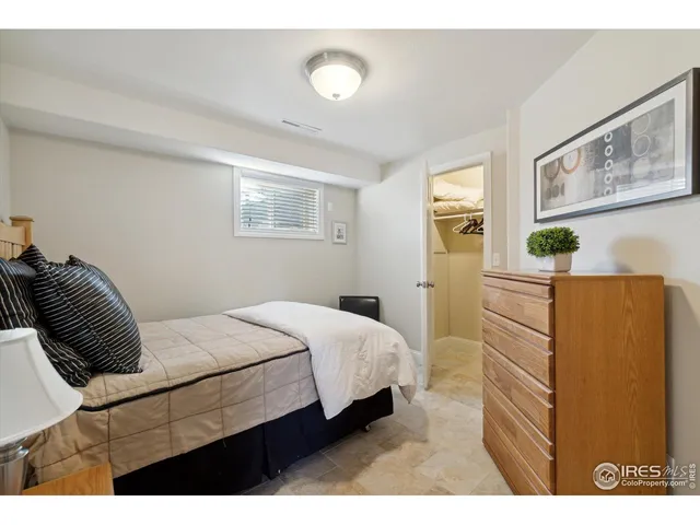 a bedroom with a bed and a cabinets