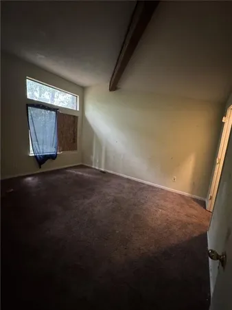 a view of an empty room and window