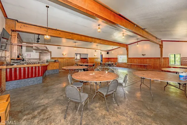 a living room with lots of furniture and lots of furniture