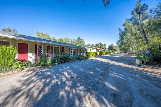 a bathroom with a sink mirror and tub