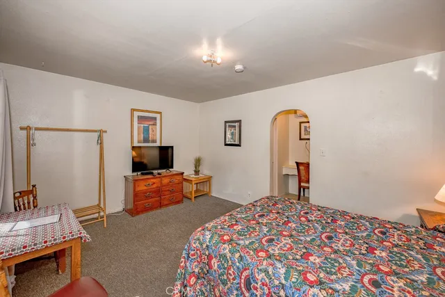 a bedroom with furniture and a window