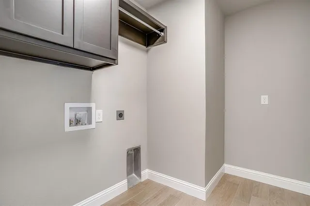 a view of hallway with wooden floor