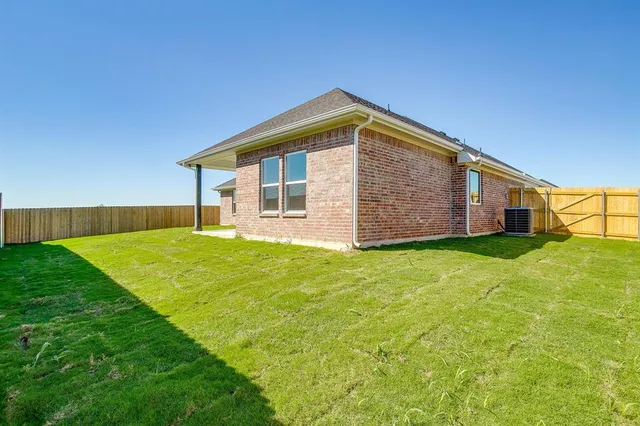 a front view of house with yard and porch