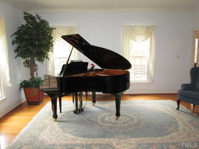 5305 Woodlaurel Court Raleigh, NC 27613 - Photo 13 of 25 Your formal living room features hardwood floors, pocket doors, and crown moldings. This serene space is lovely and full of natural light and will be wonderful for you to make it a space that is uniquely your own!