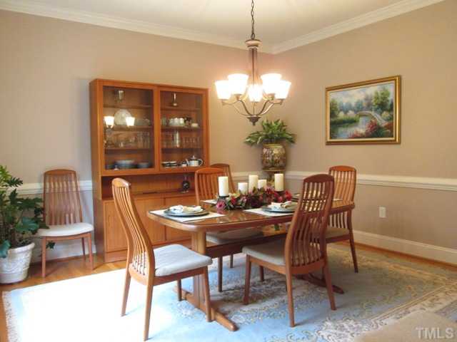 5305 Woodlaurel Court Raleigh, NC 27613 - Photo 14 of 25 Your formal dining room is the perfect place for you to entertain guests and family for any occasion! This lovely and tasteful room features hardwood floors, pocket doors, crown molding, chairrail molding, new chandelier, and new paint!