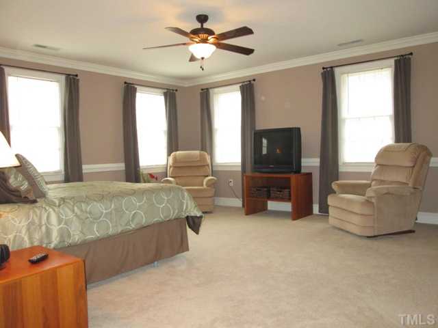 5305 Woodlaurel Court Raleigh, NC 27613 - Photo 20 of 25 The master bedroom on the second floor features a ceiling fan with light kit, a walk-in closet, crown moldings, chair rail moldings, new carpet! The closet is simply awesome and you will love the space and storage options!