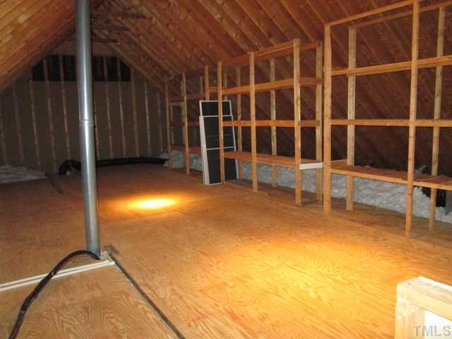 5305 Woodlaurel Court Raleigh, NC 27613 - Photo 24 of 25 The walk up attic is spacious and ready for you to finish if you so desire. Your new home has a ton of square footage already, but if you have a growing family and would like more space and would like to finish off this wonderful area, then welcome home!
