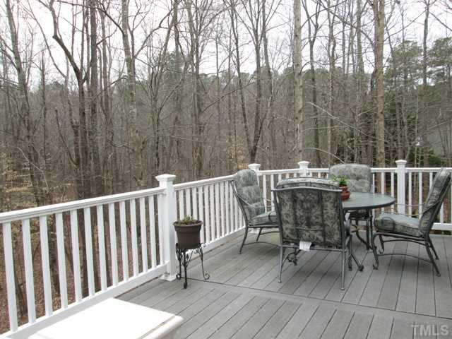 5305 Woodlaurel Court Raleigh, NC 27613 - Photo 5 of 25 The deck is the perfect place to spend lovely Carolina days or nights entertaining guests, family, or friends, sharing a meal together, outside enjoying this space surrounded by all those trees! Deck has composite flooring & vinyl railing!
