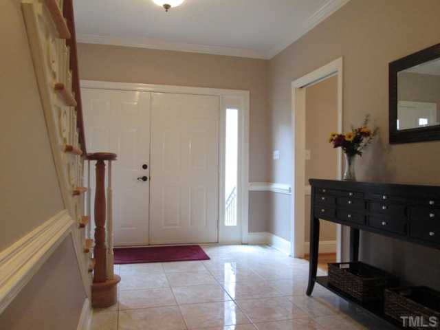 5305 Woodlaurel Court Raleigh, NC 27613 - Photo 8 of 25 The foyer receiving area features newer tile flooring, french door entry, new paint, crown molding detailing, and chairrail molding detail. Very spacious receiving space makes is wonderful for many guests to arrive at the same time, there plenty of room!
