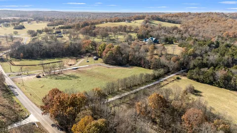 a view of a pool with a yard