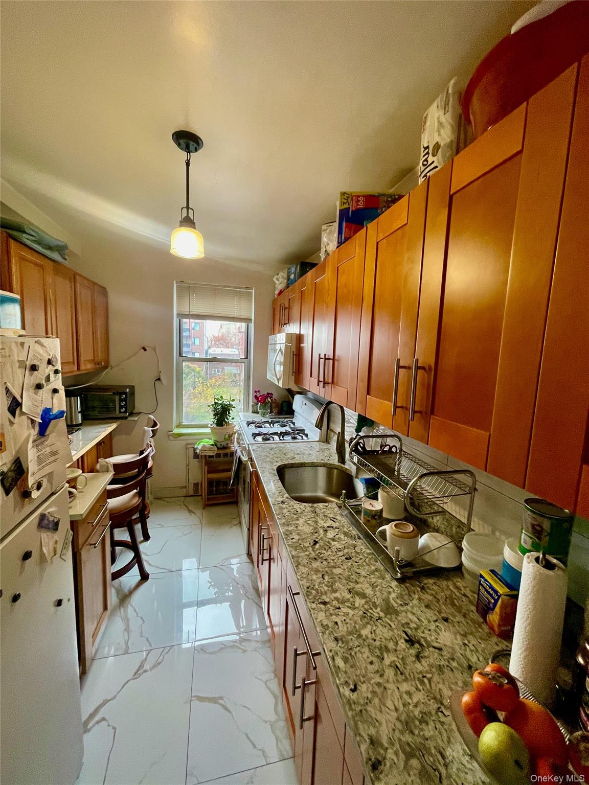 134-33 Blossom Avenue, Unit 3B Queens, NY 11355 - Photo 5 of 7 a very nice looking dining room with a large window