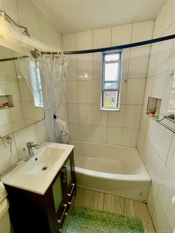 a bathroom with a sink and a bathtub