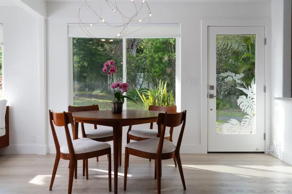 a dining room with furniture and window