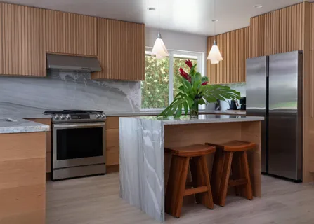 a kitchen with a refrigerator and a sink