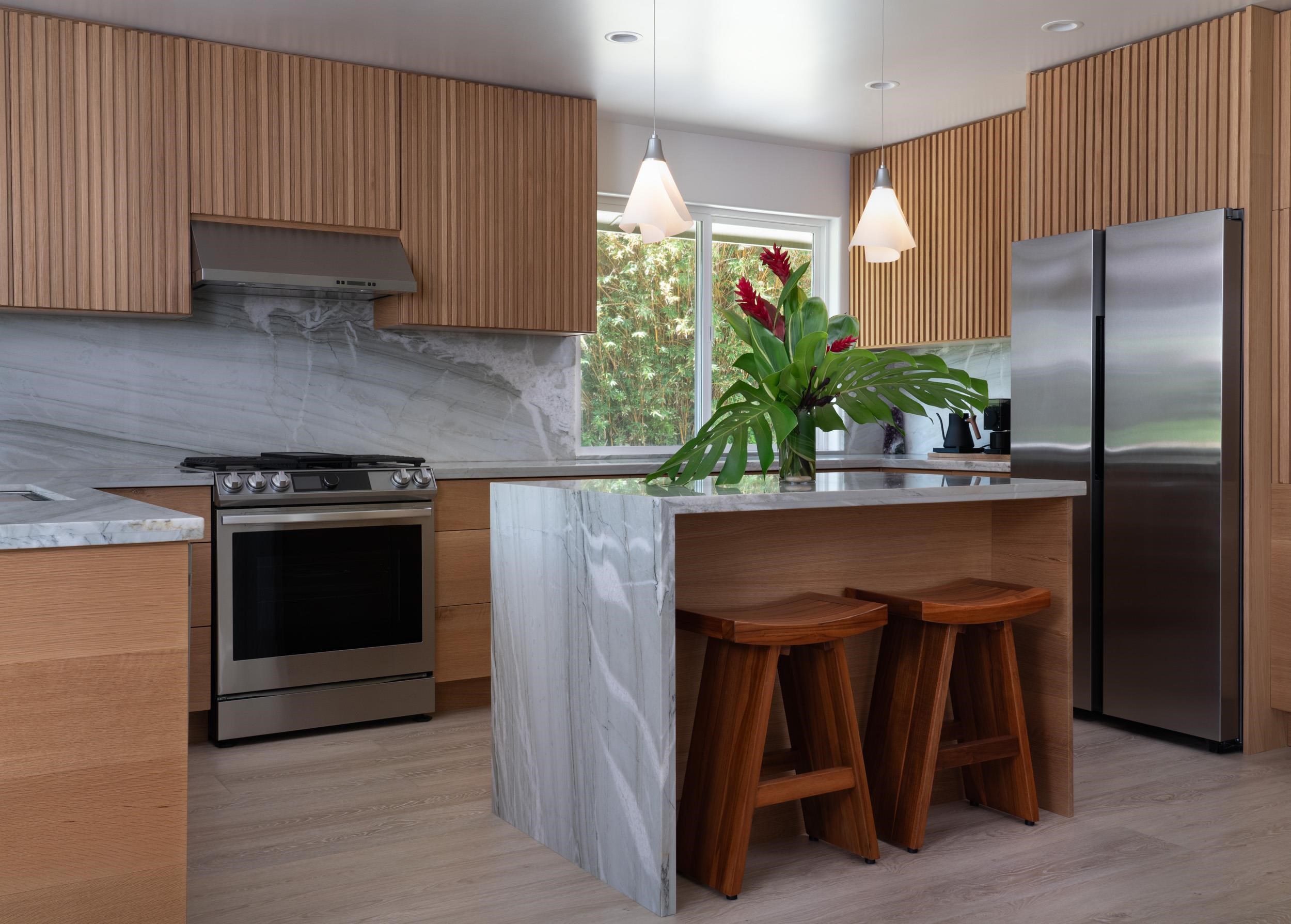 453 North Honokala Road Haiku, HI 96708 - Photo 8 of 33 a kitchen with a refrigerator and a sink