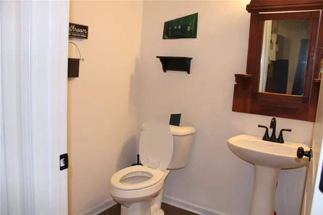 a bed sitting in a bedroom next to a wooden floor