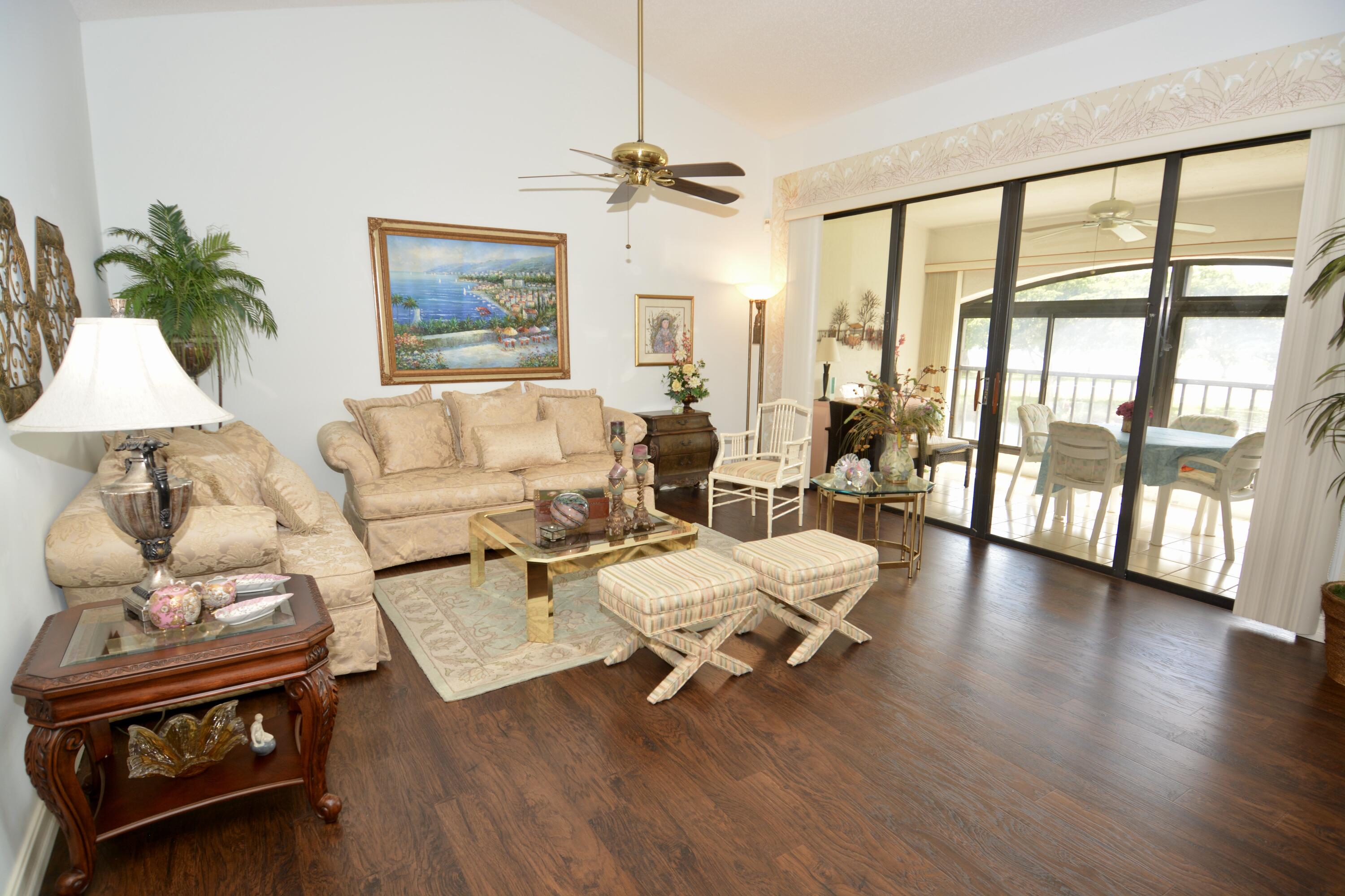 8336 Waterline Drive, Unit 201 Boynton Beach, FL 33472 - Photo 11 of 23 a living room with furniture and a large window