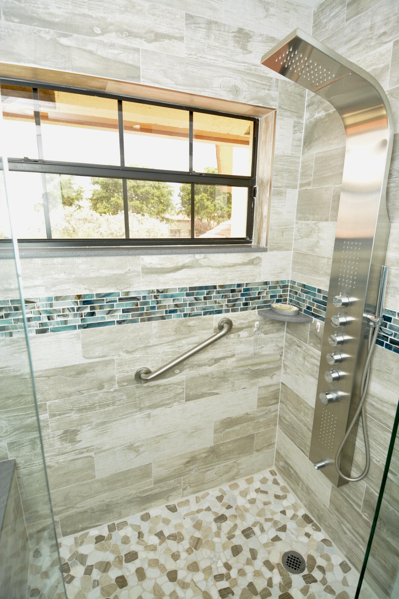 8336 Waterline Drive, Unit 201 Boynton Beach, FL 33472 - Photo 17 of 23 a bathroom with shower