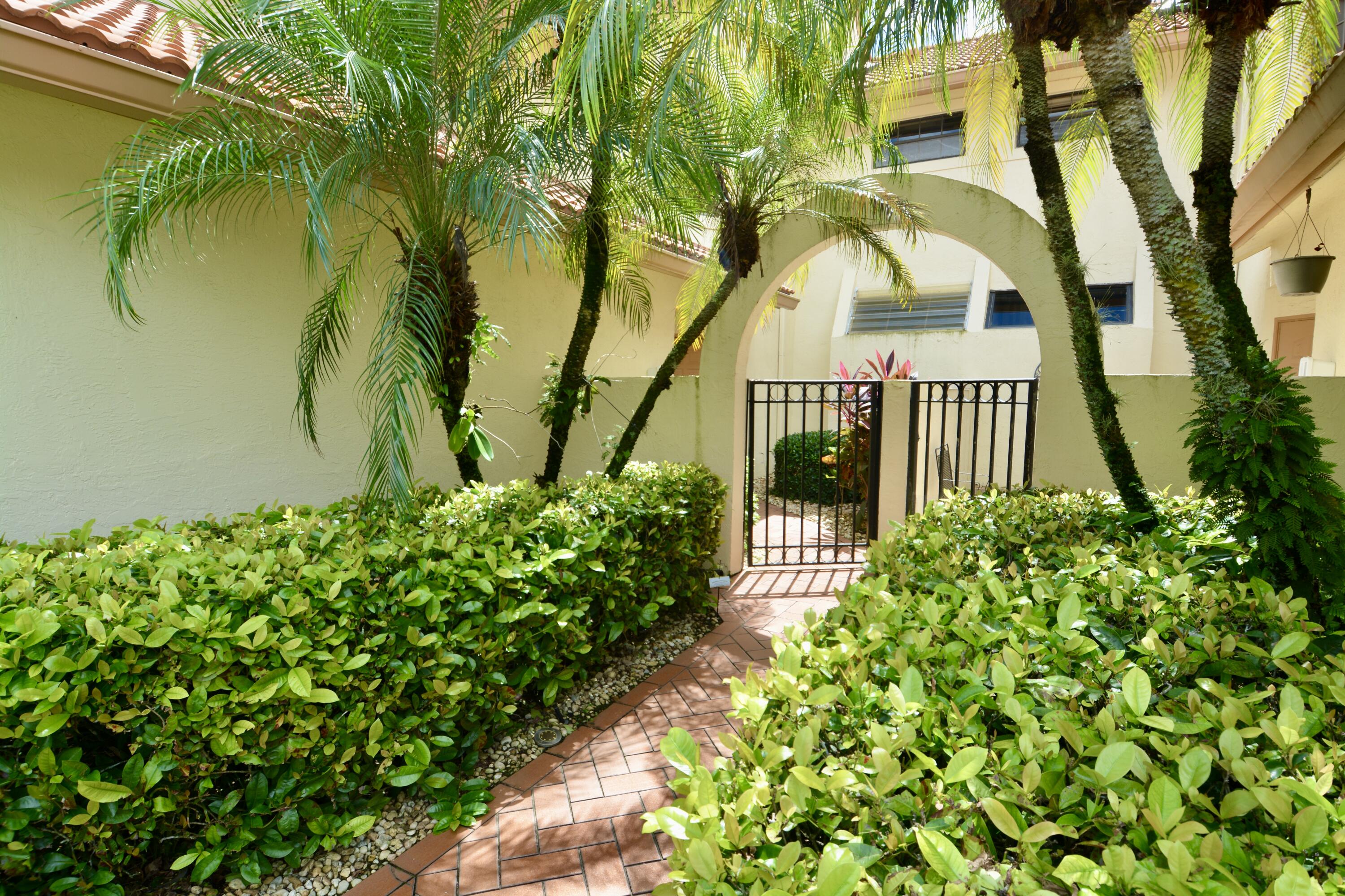 8336 Waterline Drive, Unit 201 Boynton Beach, FL 33472 - Photo 2 of 23 a view of a garden with plants