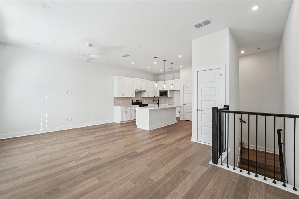 200 West 56th Street, Unit 8101 Austin, TX 78751 - Photo 2 of 13 Upstairs the living, dining, and kitchen that’s all about light, space, and flow. (Sample photo of finishes and layout)