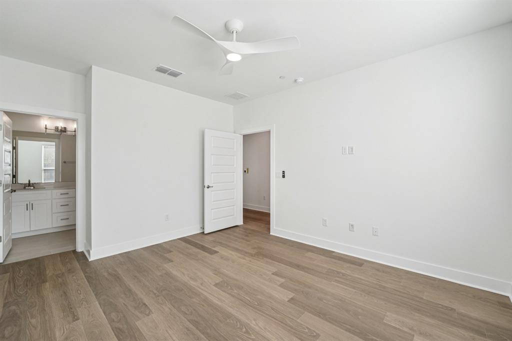 200 West 56th Street, Unit 8101 Austin, TX 78751 - Photo 9 of 13 The primary bedroom sits on the entry level, offering a quiet retreat or can
easily be transformed into a private office or studio space. (Sample photo of finishes and layout)