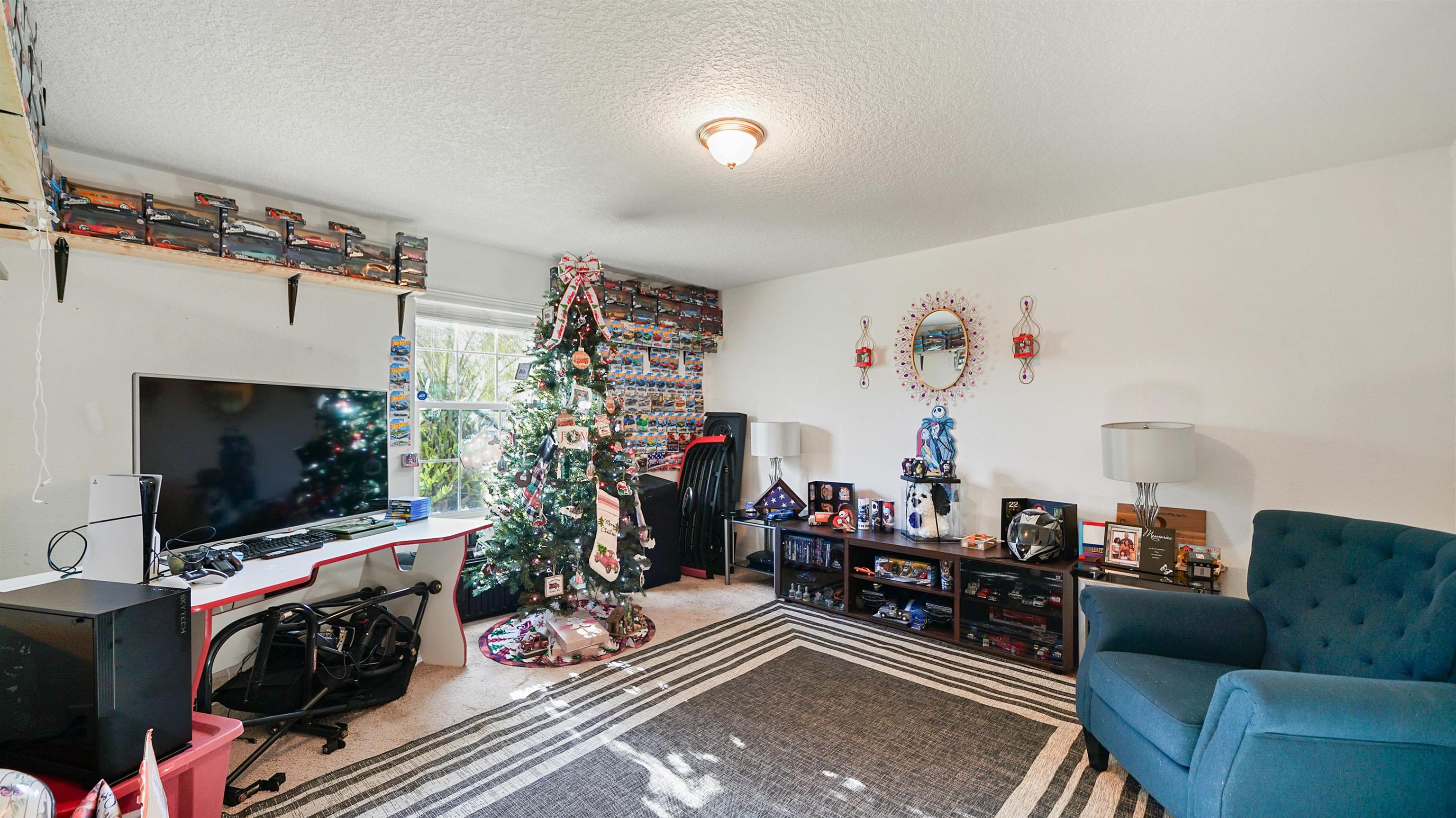 77102 Crosscut Way Yulee, FL 32097 - Photo 14 of 21 a living room with furniture and a flat screen tv