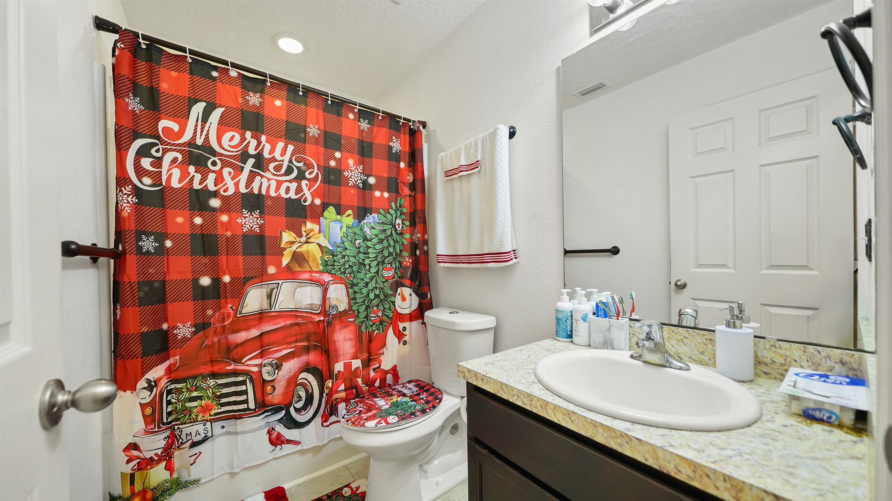 77102 Crosscut Way Yulee, FL 32097 - Photo 16 of 21 a bathroom with a sink and a mirror