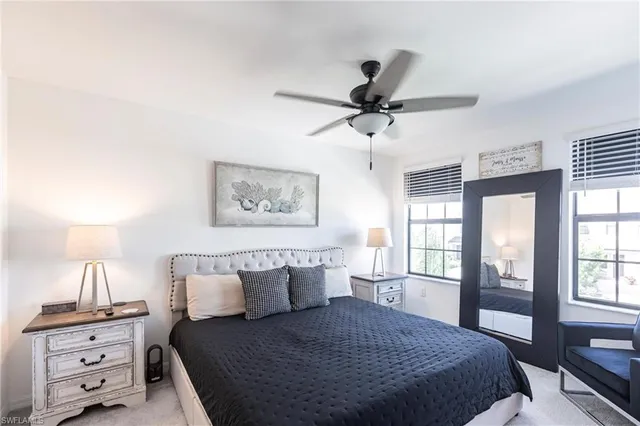 a view of a livingroom with furniture and a ceiling fan