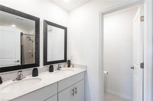 a bathroom with a shower and a sink