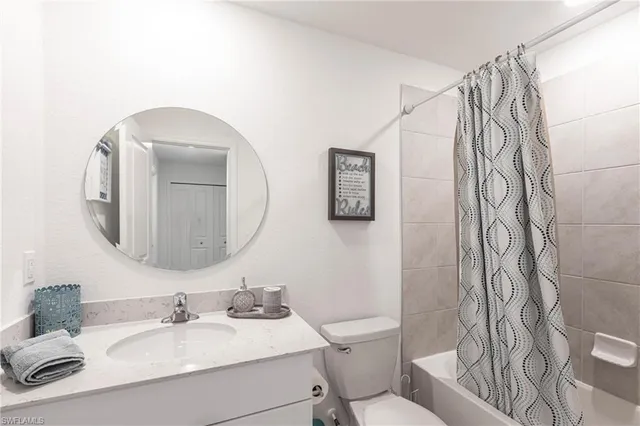 a bedroom with a bed and a table