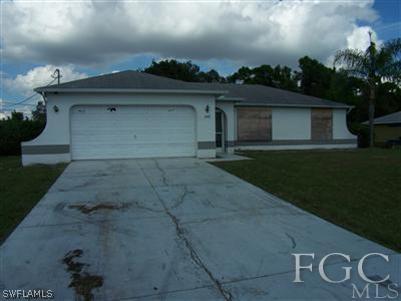 8445 Bamboo Road Fort Myers, FL 33967 - Photo 1 of 5 a view of a house with a yard