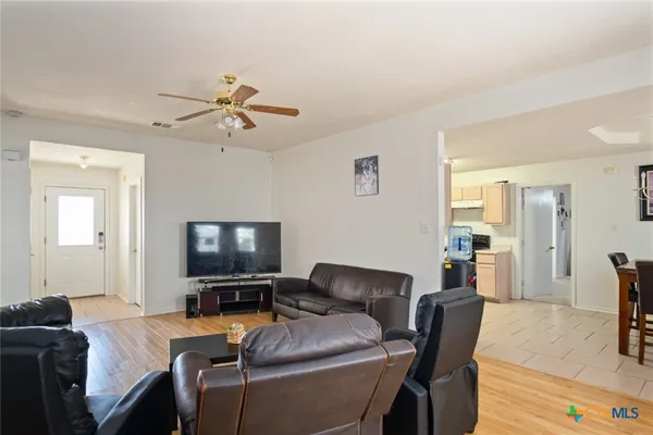 a living room with furniture and a flat screen tv