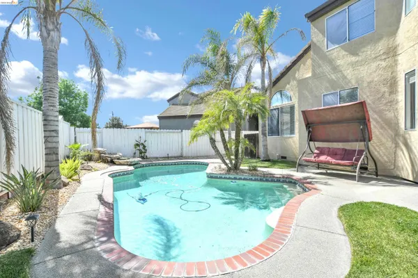 a view of a backyard with potted plants