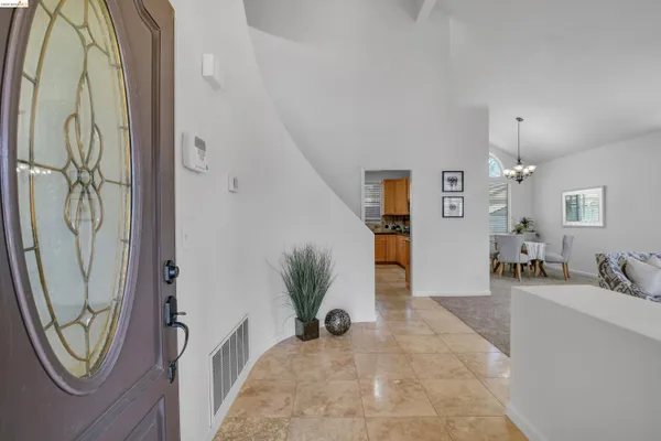 a view of a hallway with dining area and entryway